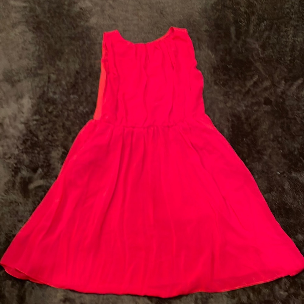 Red chiffon sleeveless dress. New without tags. Never worn size medium